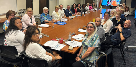 photo of an Advisory Council meeting with 30+ individuals at a table
